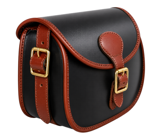 Black and brown leather cartridge bag with buckle closure, brass hardware, and adjustable shoulder strap